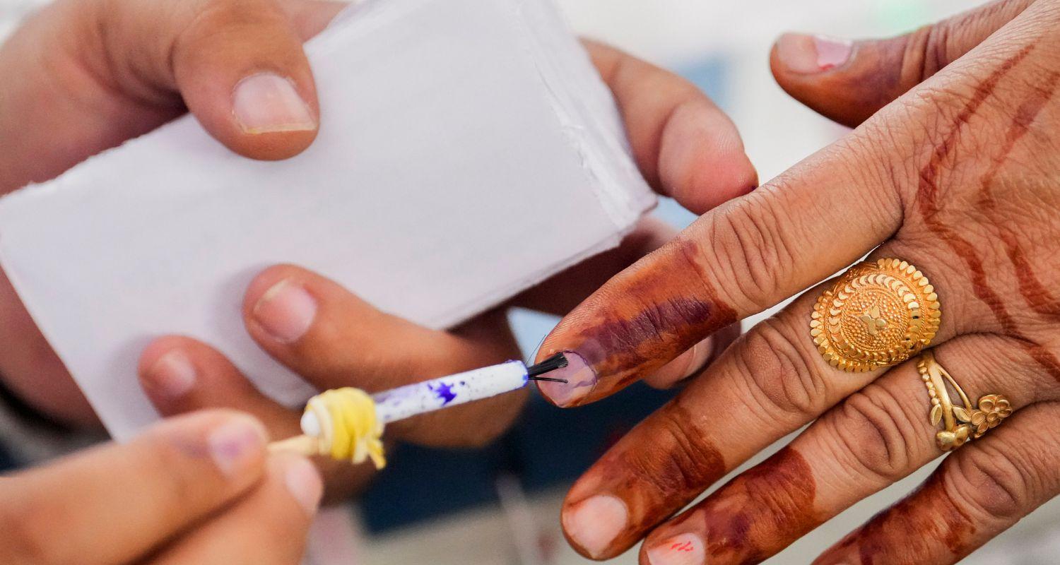 Indelible ink being applied to a voter.