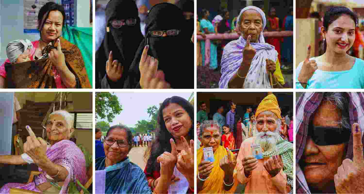 Indian voters showing inked fingers after casting their vote. 