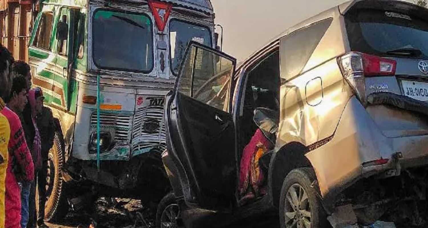 A car collides with a truck on an Indian road. Image by the Press Trust of India.