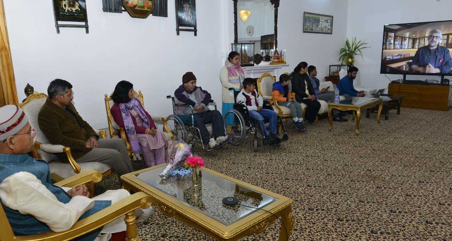  "Video conference featuring the Governor of Himachal Pradesh and representatives from the Muscular Dystrophy community engaging in discussions with film director Vivek Agnihotri."