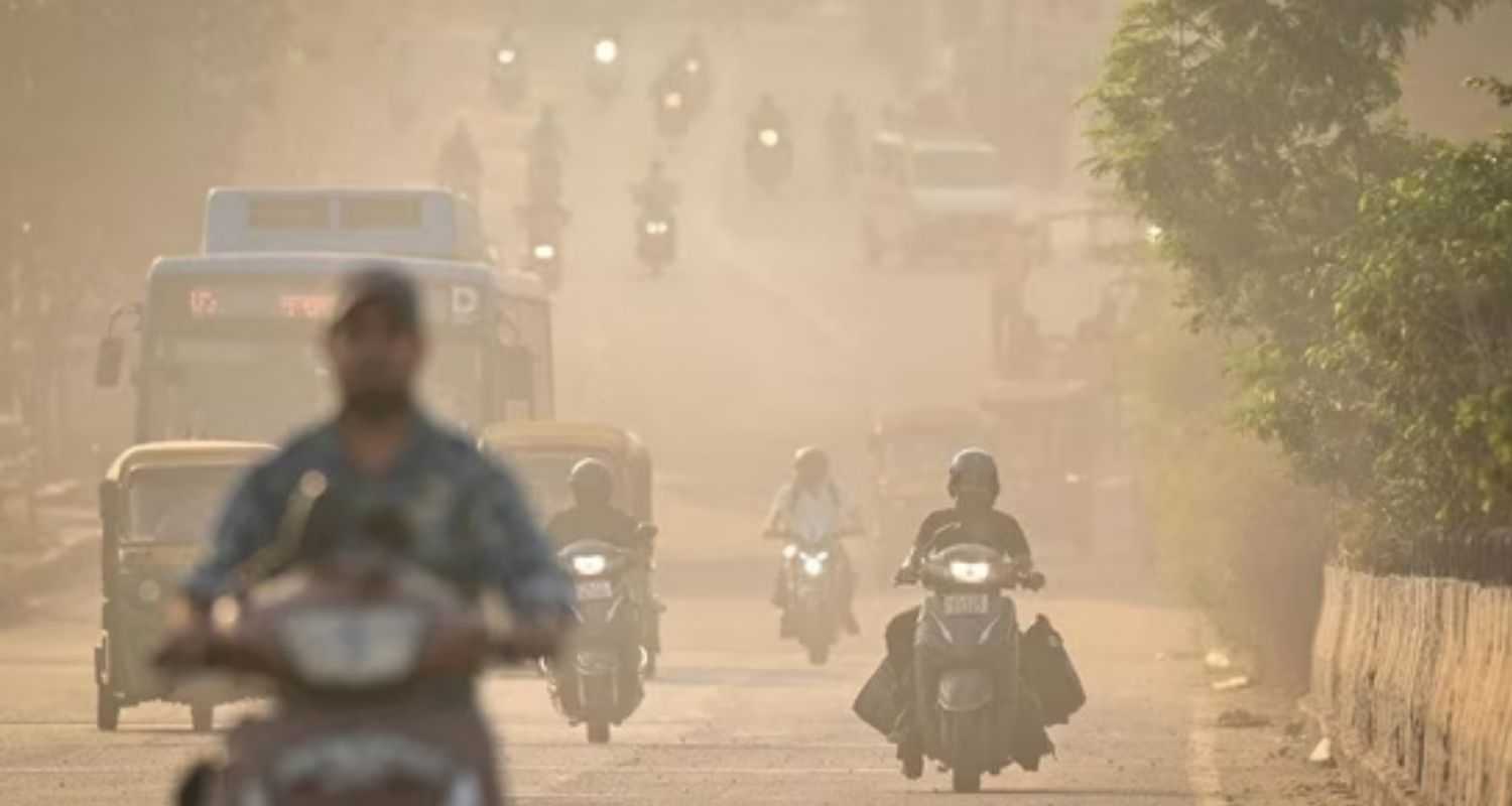 Motorists drive on a smoke-filled highway.