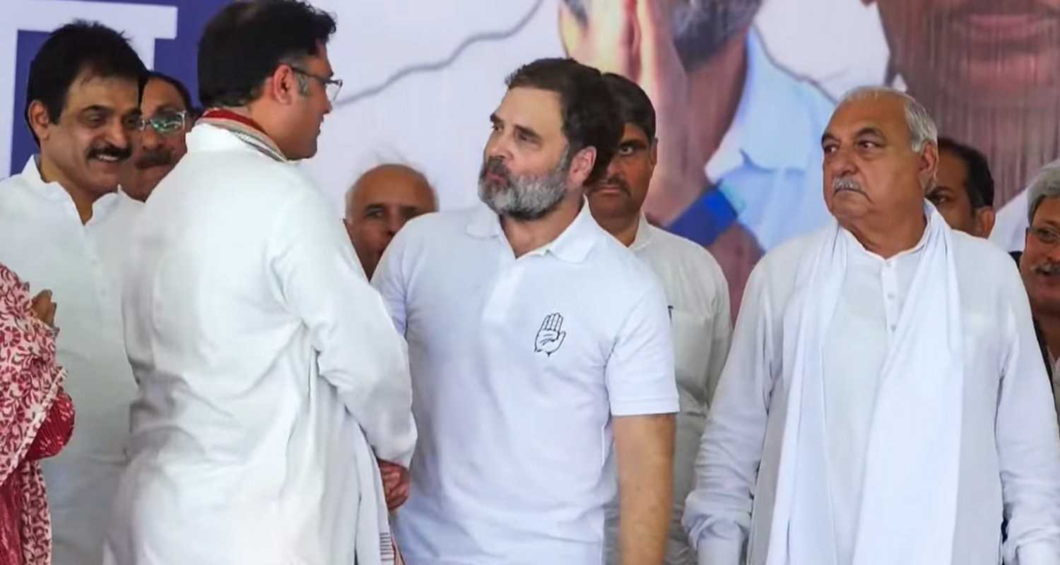 Leader of Opposition in Lok Sabha and Congress leader Rahul Gandhi with former MP Ashok Tanwar as the latter joins Congress during a public ahead of Haryana Assembly elections, in Mahendragarh district, Haryana, Thursday, Oct. 4, 2024. Former Haryana chief minister Bhupendra Patel is also seen.