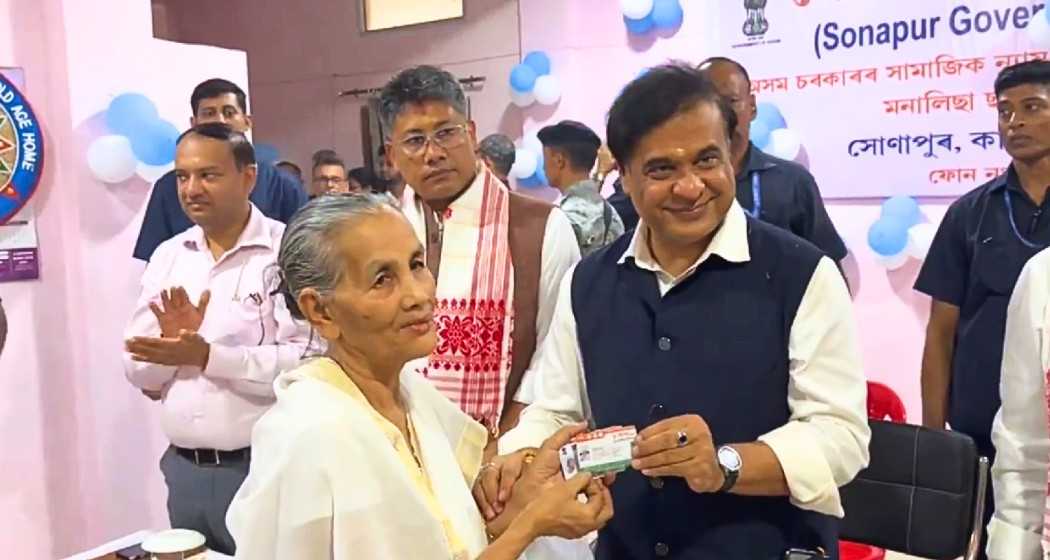 Assam Chief Minister Himanta Biswa Sarma presents Aadhaar, ration, Ayushman, and Orunodoi cards to an elderly resident of Sonapur Government Old Age Home on the occasion of Raksha Bandhan.