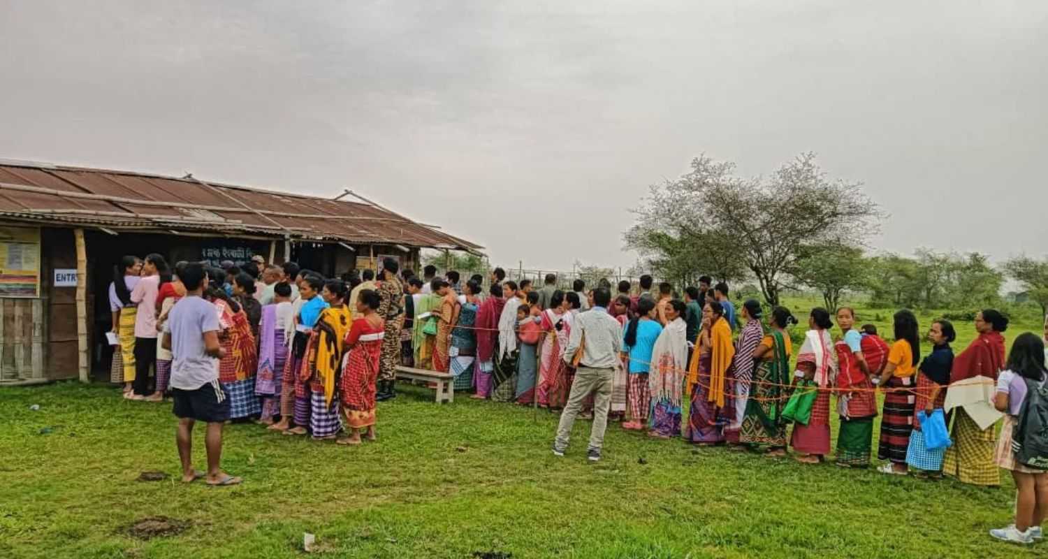 Long queues of voters, at polling stations in Assam casting their vote in the first phase of the General Elections 2024.