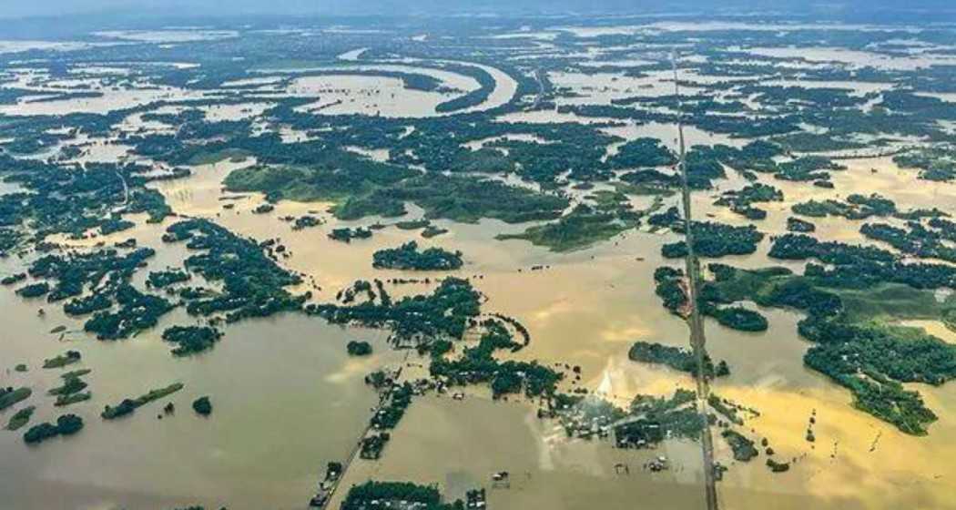 Aerial view of flood-affected areas in Assam following heavy rainfall, showcasing the extent of the devastation.