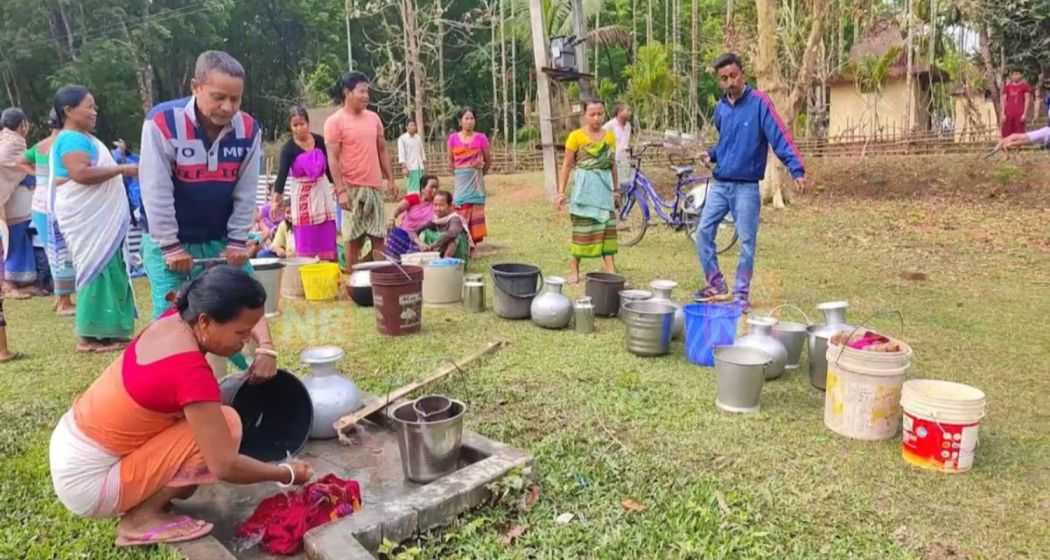 Residents of Ravapara village in Assam's Barpeta line up to collect water from a hand pump, their sole source for daily needs.