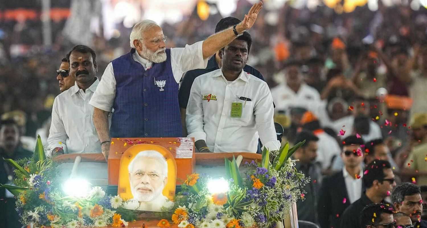 Prime Minister Narendra Modi waves at supporters as he arrives for a public meeting ahead of Lok Sabha elections, in Salem, Tamil Nadu, Tuesday, March 19, 2024.