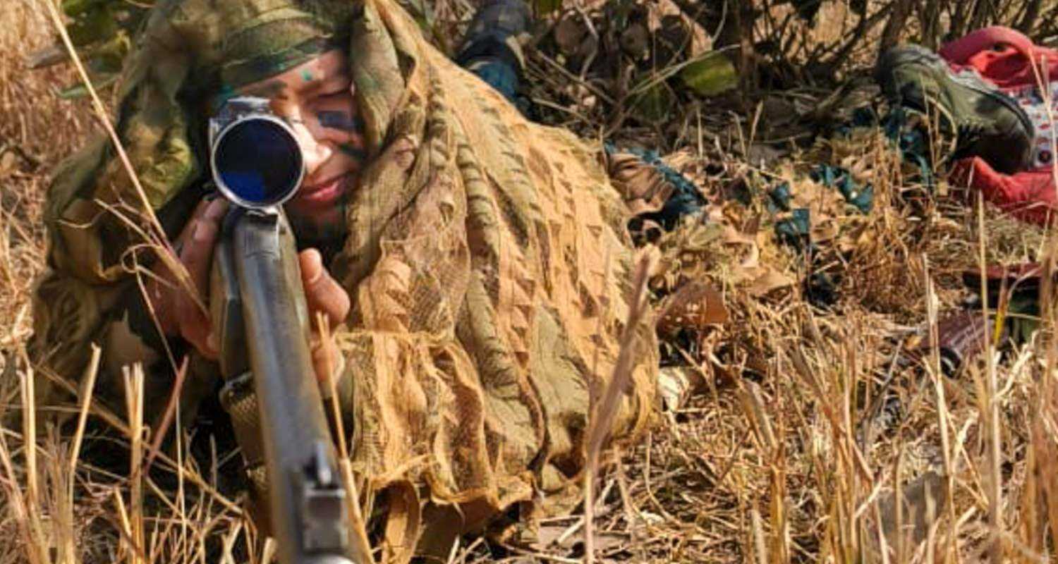 BSF Sub-inspector Suman Kumari wearing a ghillie suit in a training exercise.