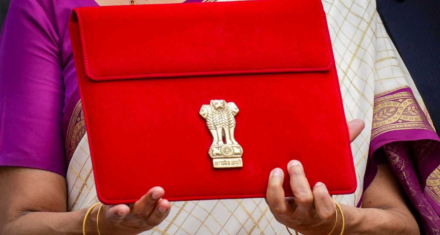 Union Finance Minister Nirmala Sitharaman carries a red pouch carrying the Budget documents, outside the Finance Ministry in North Block. 