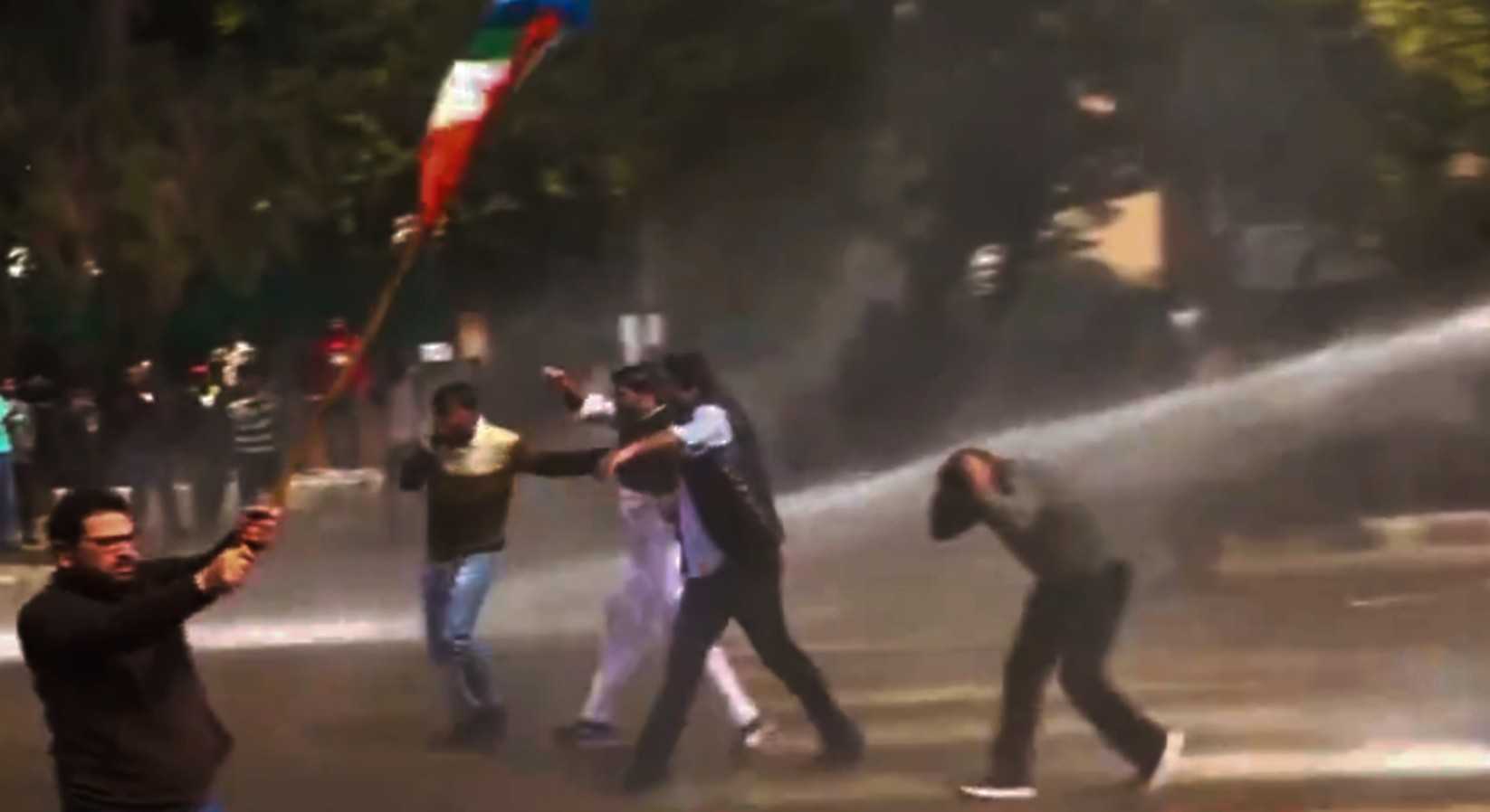 Police use water cannons to control NSUI members protesting near Sector 35.