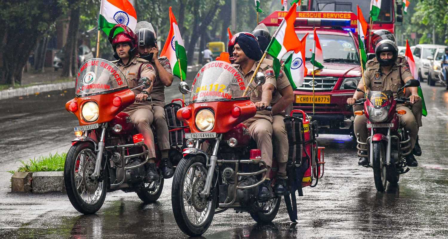 Fire department personnel take part in a rally under 'Har Ghar Tiranga' campaign ahead of Independence Day, in Chandigarh, Wednesday, Aug. 14, 2024.