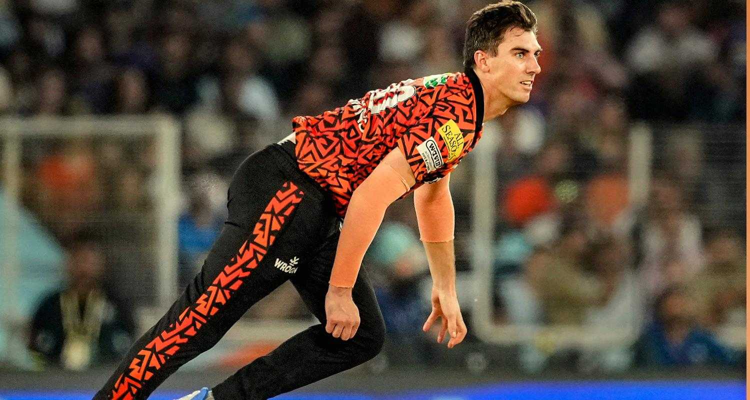 Pat Cummins bowling during an IPL match.