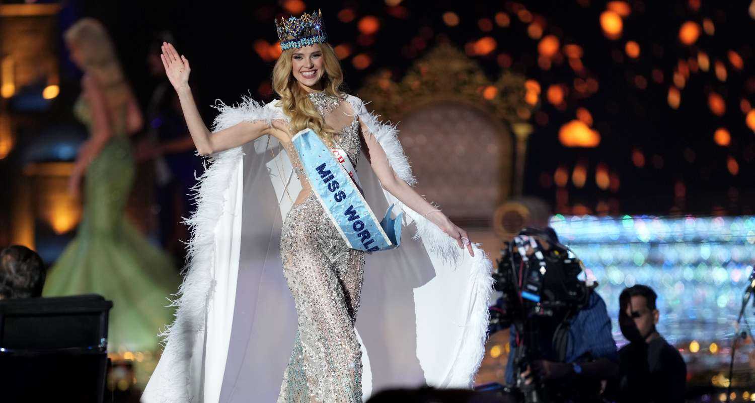 Czech Republic's Krystyna Pyszkova takes a victory walk on the runway.