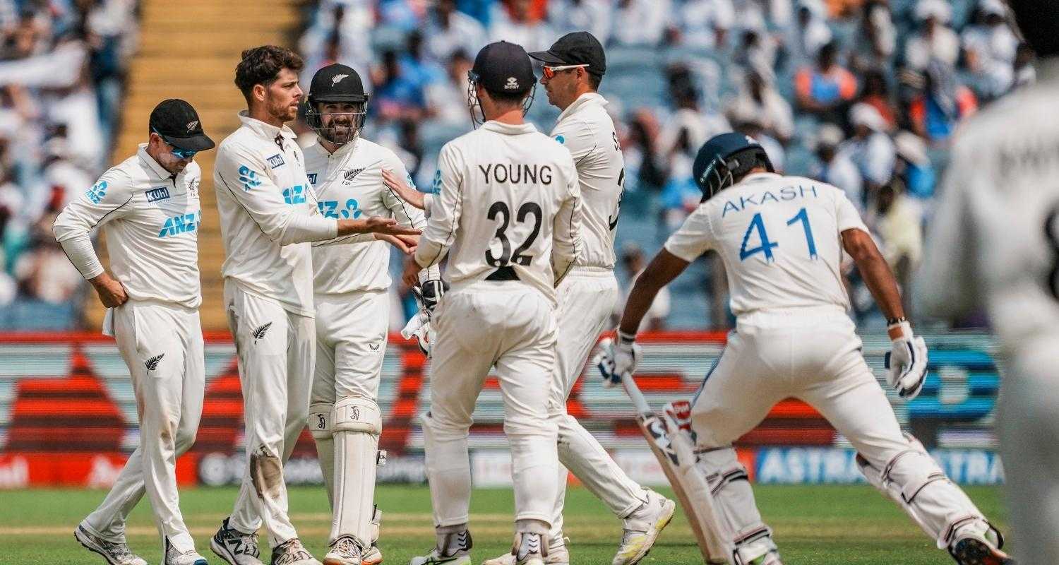 New Zealand's Mitchell Santner with his teammates celebrates the wicket of India's Akash Deep during the second day of the second test cricket match between India and New Zealand, at the Maharashtra Cricket Association Stadium, in Pune.