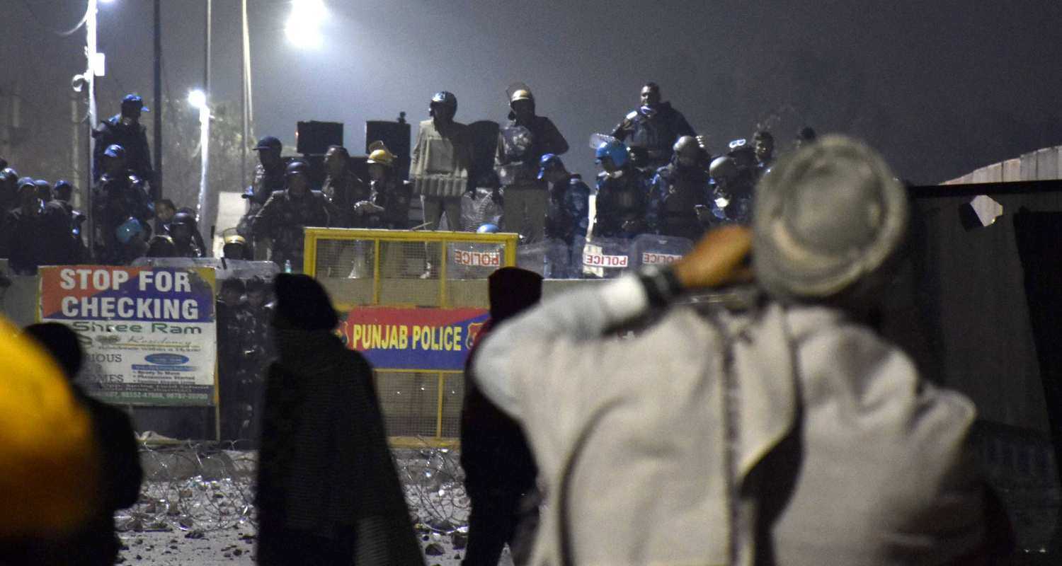 Security personnel stand guard at a roadblock at the Shambhu Border amid farmers' protest during the Samyukta Kisan Morcha. 