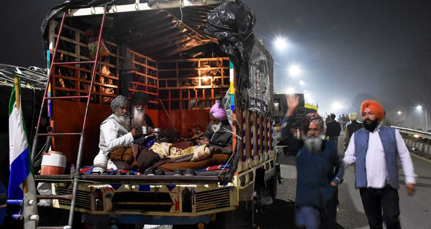  Farmers participating in protests at the Shambhu border, residing in the rear section of a truck.