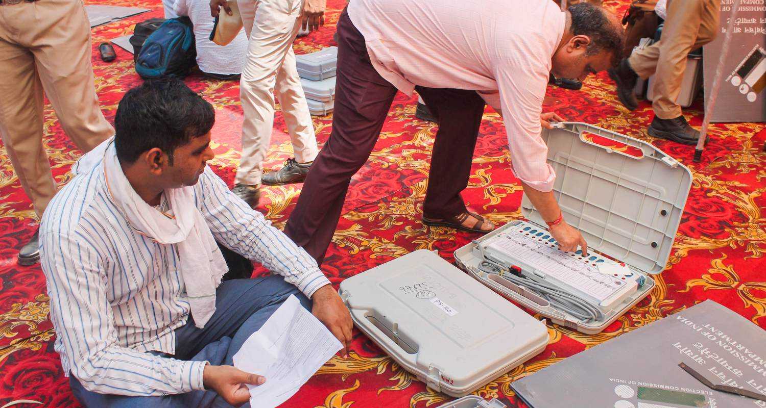 Polling officials check election material before leaving for their designated polling stations on the eve of the sixth phase of Lok Sabha polls, in Faridabad, Friday, May 24, 2024.