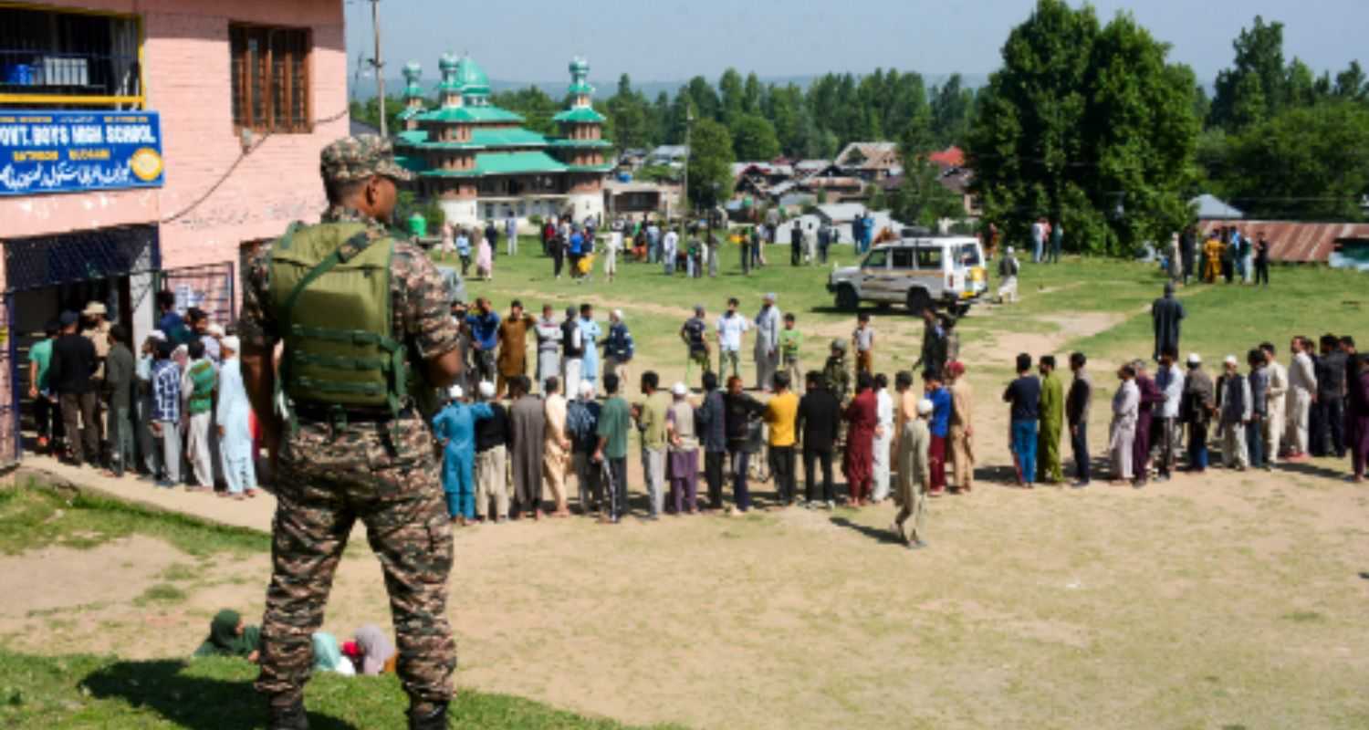 Voters wait to cast their votes during the 5th phase of Lok Sabha elections, in Budgam district of central Kashmir on Monday, May 20, 2024.