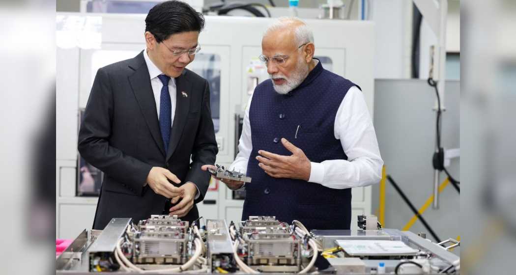 Prime Minister of Singapore, Lawrence Wong, and Indian Prime Minister Narendra Modi share a moment during their industrial visits in Singapore on Thursday, following their discussions on elevating bilateral relations to a Comprehensive Strategic Partnership.