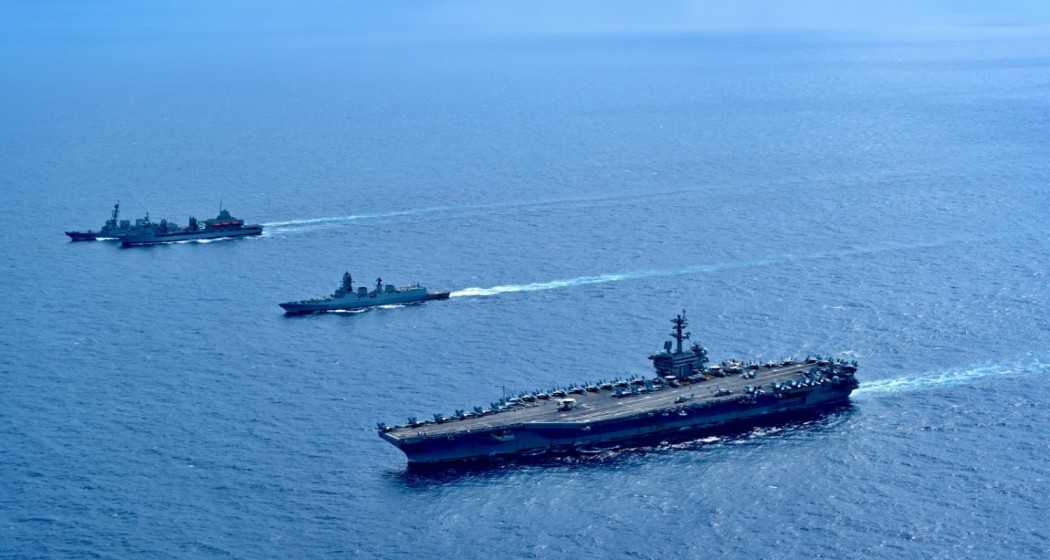 Indian Navy ships INS Aditya and INS Visakhapatnam engage in a Maritime Partnership Exercise with the US Naval Carrier Strike Group, featuring the USS Theodore Roosevelt and USS Daniel Inouye, in the Arabian Sea.