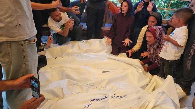 The bodies of at least one woman and three children were counted on Thursday in the Al-Aqsa Martyrs Hospital, reports said. 