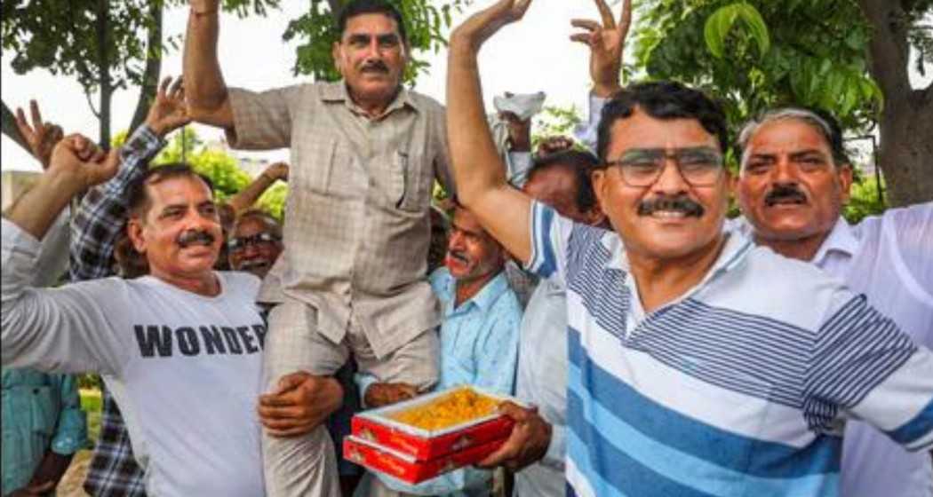 West Pakistani Refugees (WPRs) celebrate after the J&K administration granted proprietary rights to WPRs for land in the union territory, in Jammu on Wednesday. 