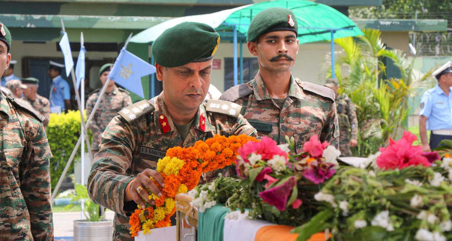 An army personnel pays tribute to the mortal remains of Lance Naik Subash Kumar after he was injured and later succumbed during a thwarted infiltration bid by terrorists along Line of Control in J&K's Poonch district, in Jammu, Wednesday, July 24, 2024. 