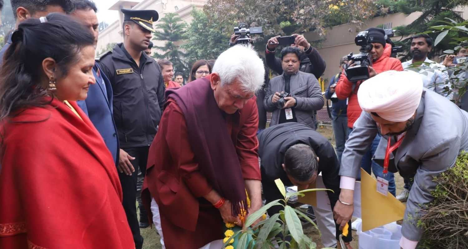 Jammu and Kashmir LG Manoj Sinha planting a ceremonial sapling at the JK House in New Delhi at the JK Sambhaav Diwas