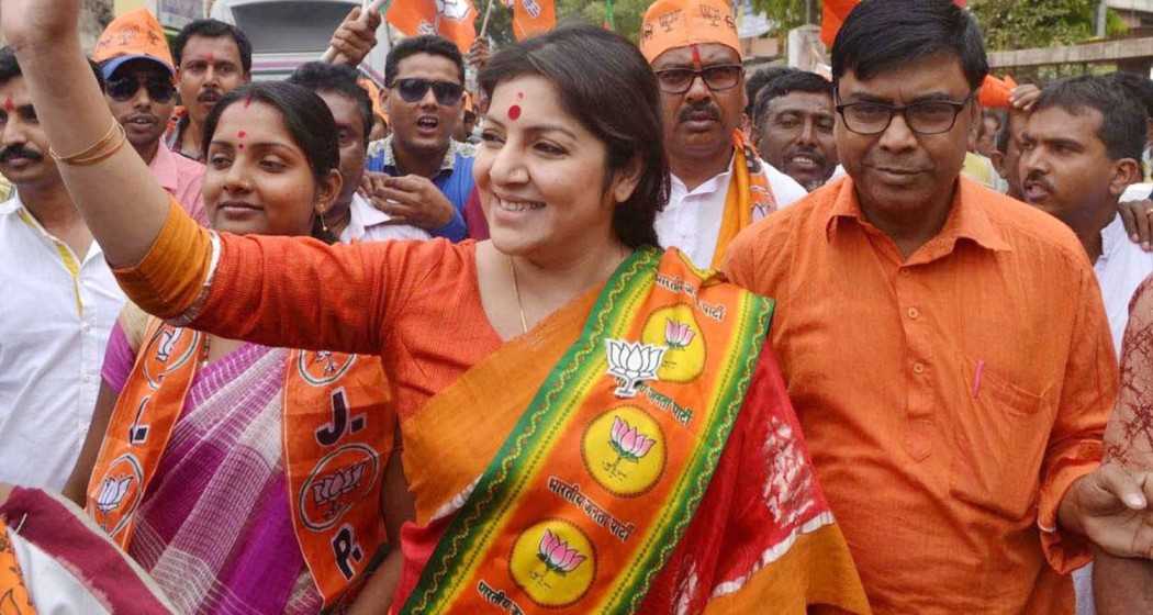 BJP MP Locket Chatterjee waving supporters.