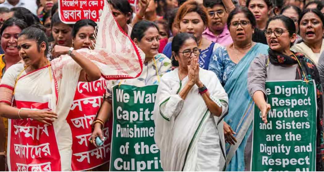  Mamata Banerjee with TMC MPs Sayoni Ghosh and June Malia walk at a protest march to demand fast-track investigation by the CBI.