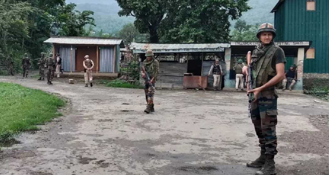 Security forces stand guard in Jiribhim, Manipur, amid escalating tensions.