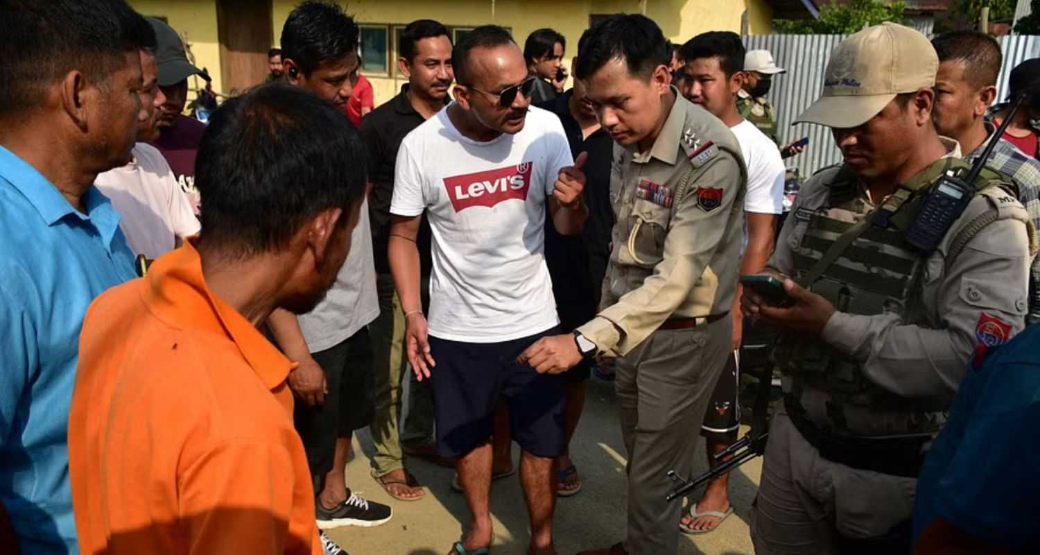 Poll officers at the spot of the shooting in Manipur's Moirangkampu Sajeb.