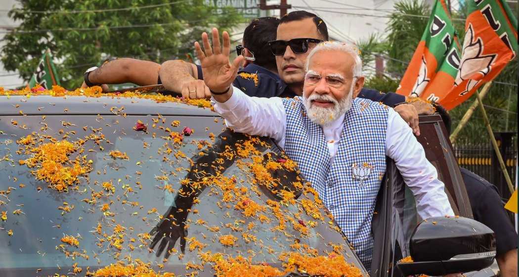 Prime Minister Narendra Modi waves to supporters upon his arrival for a public meeting, ahead of Lok Sabha elections, in Agartala, on Wednesday.