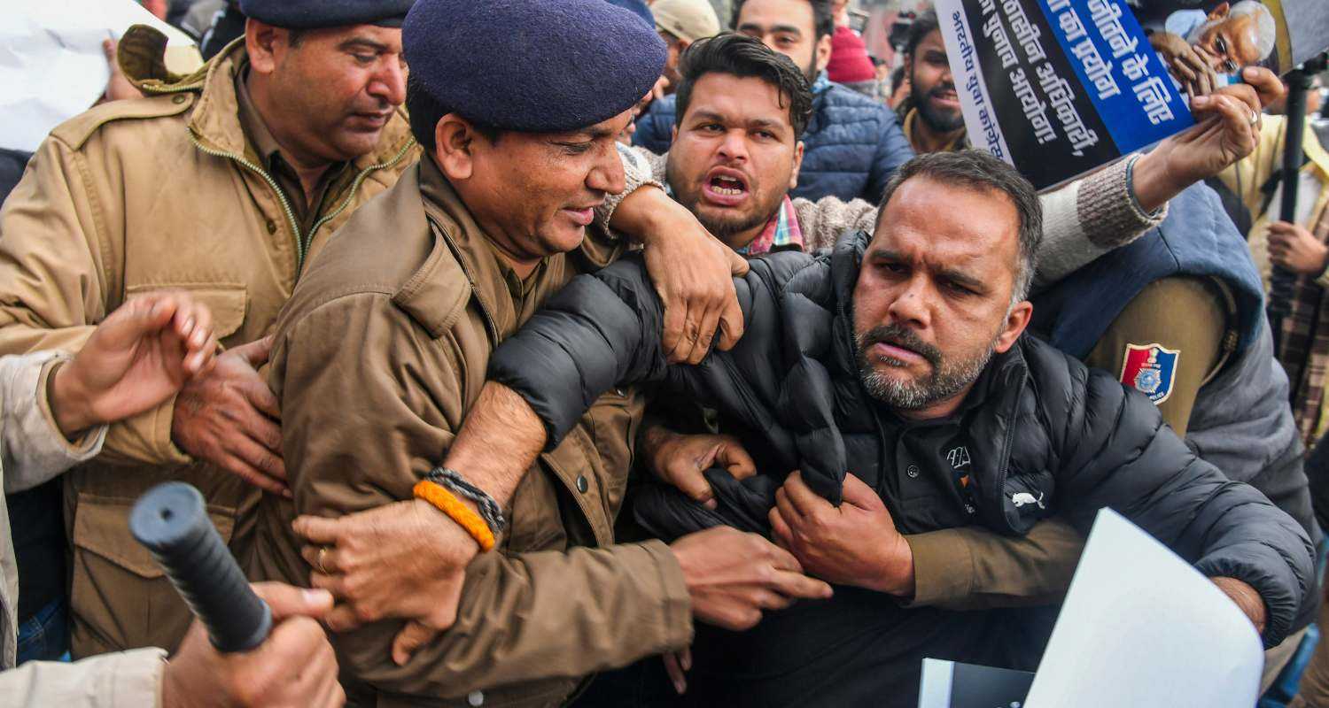 Police evict Youth Congress workers sitting on protest outside  Municipal Corporation office in Chandigarh against alleged fraud in the mayoral election. 