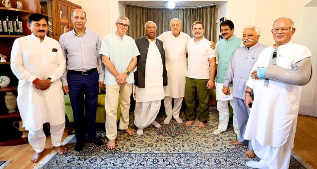 Congress leaders Rahul Gandhi and Mallikarjun Kharge meet with Farooq Abdullah at his residence in Srinagar during a recent visit, discussing key political strategies for the upcoming elections.