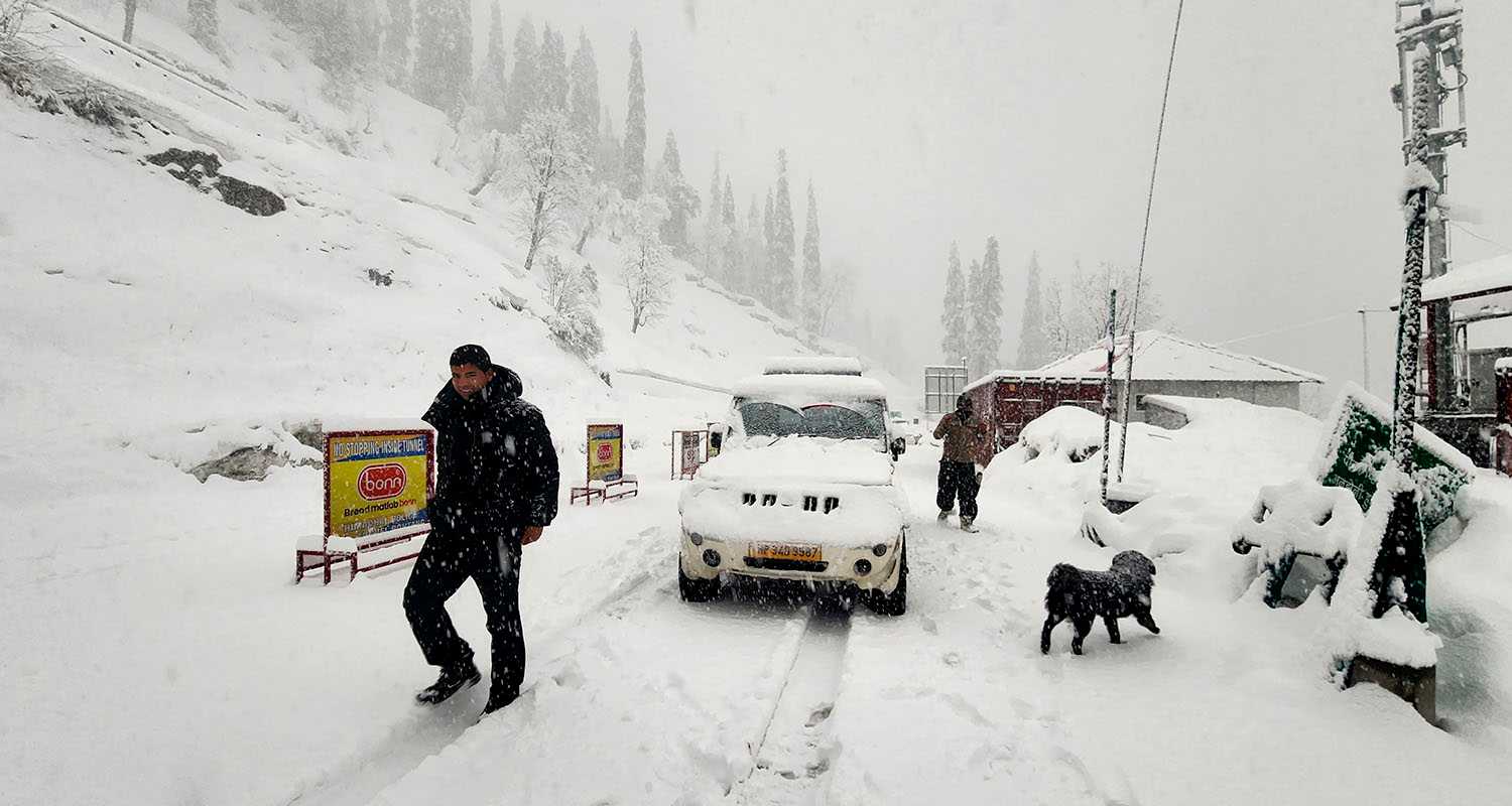 Snow-covered road at the Atal Tunnel Rohtang South Portal during snowfall, in Manali district