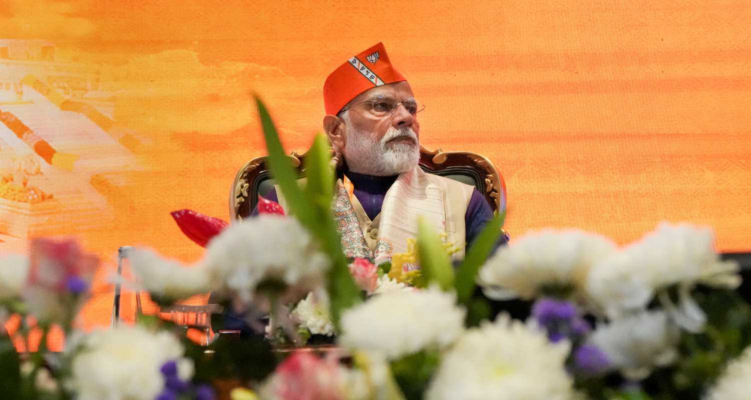 PM Modi wearing a BJP cap in the BJP meeting