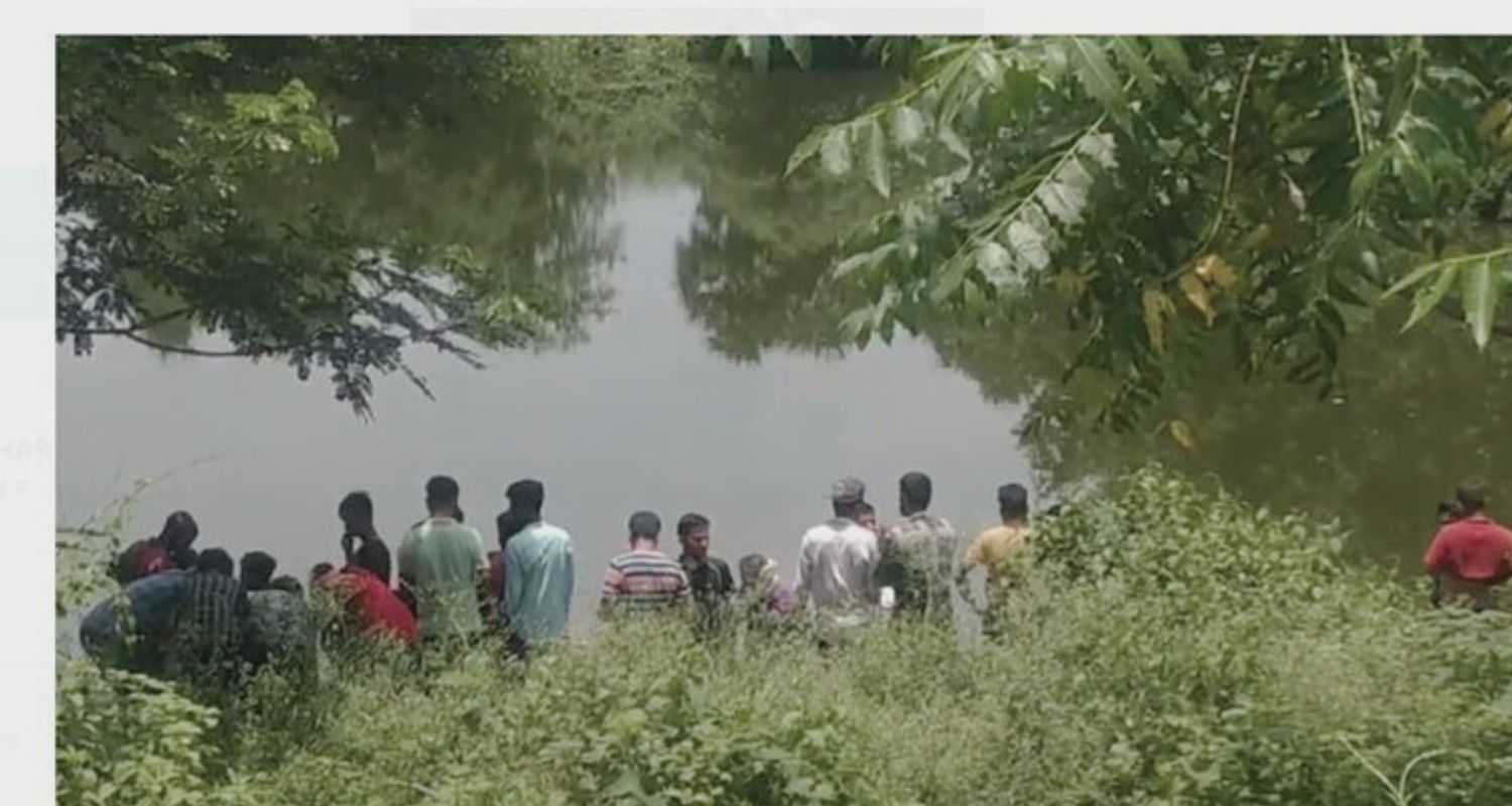 Locals gathered around the pond where the recovery was made. Image via special arrangement.