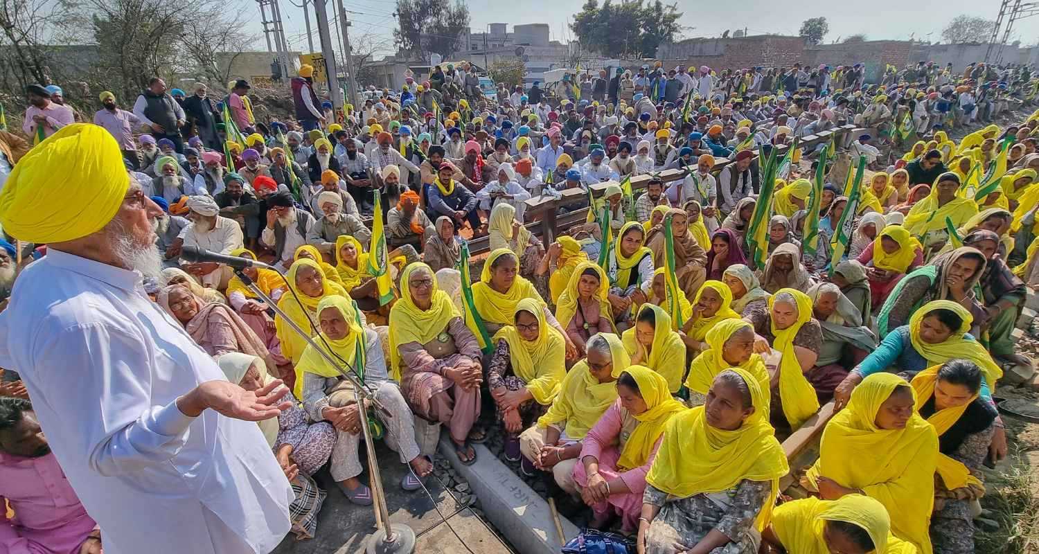  Farmer leader Jhanda Singh Jethuke addresses fellow protestors during the 'rail roko' protest, in Bathinda. 