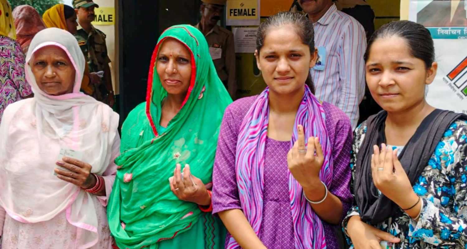 Voters show their fingers marked with indelible ink after casting their votes during the Nalagarh assembly bypoll, in Solan district of Himachal Pradesh, Wednesday. 