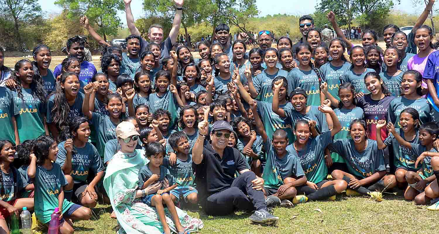 Former cricketer Sachin Tendulkar with wife Anjali Tendulkar pose for group photos with budding football players of Yuwa Foundation, in Ranchi