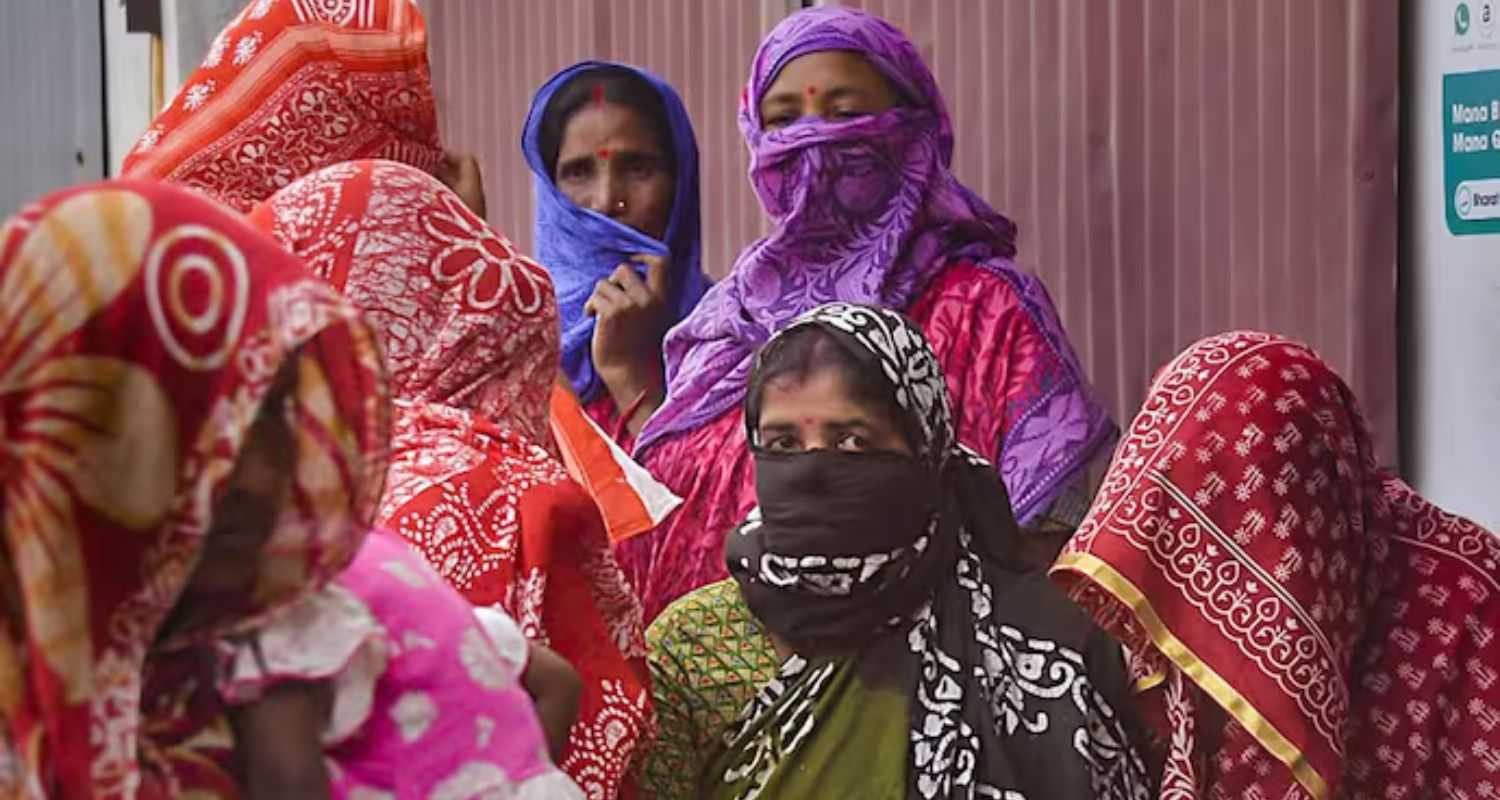 Local women at Sandeshkhali wait to meet NCW Chairperson Rekha Sharma during her visit to Sandeshkhali, on Monday. 