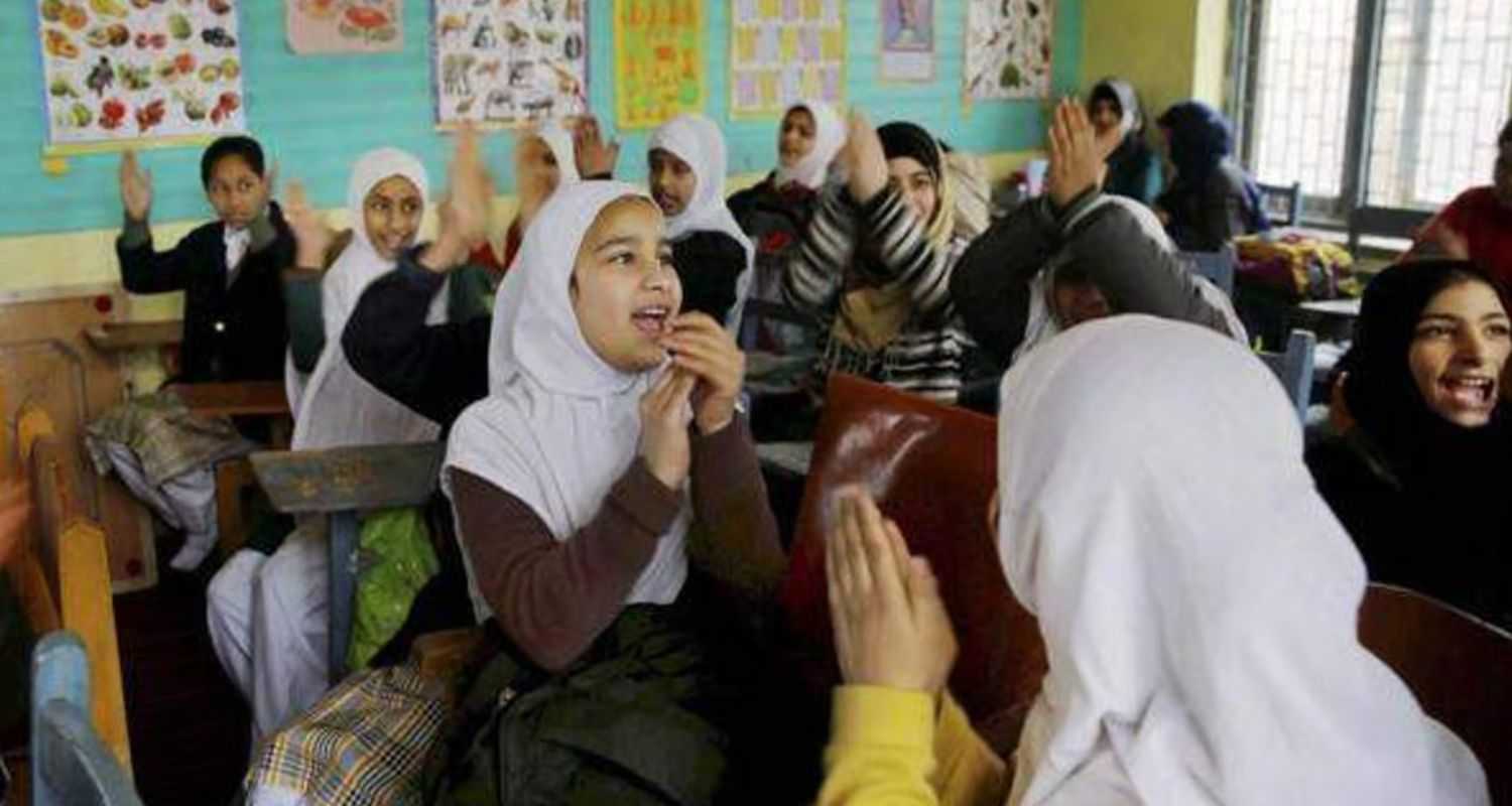 Female school children playing wearing Hijab in a school in Jammu Kashmir