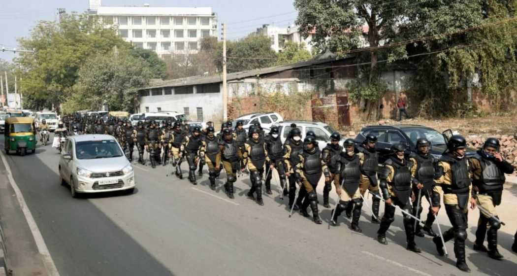 Haryana Police personnel conduct a march near Rajiv Chowk as part of preparations for the farmers' tractor rally in Gurugram. File Photo.