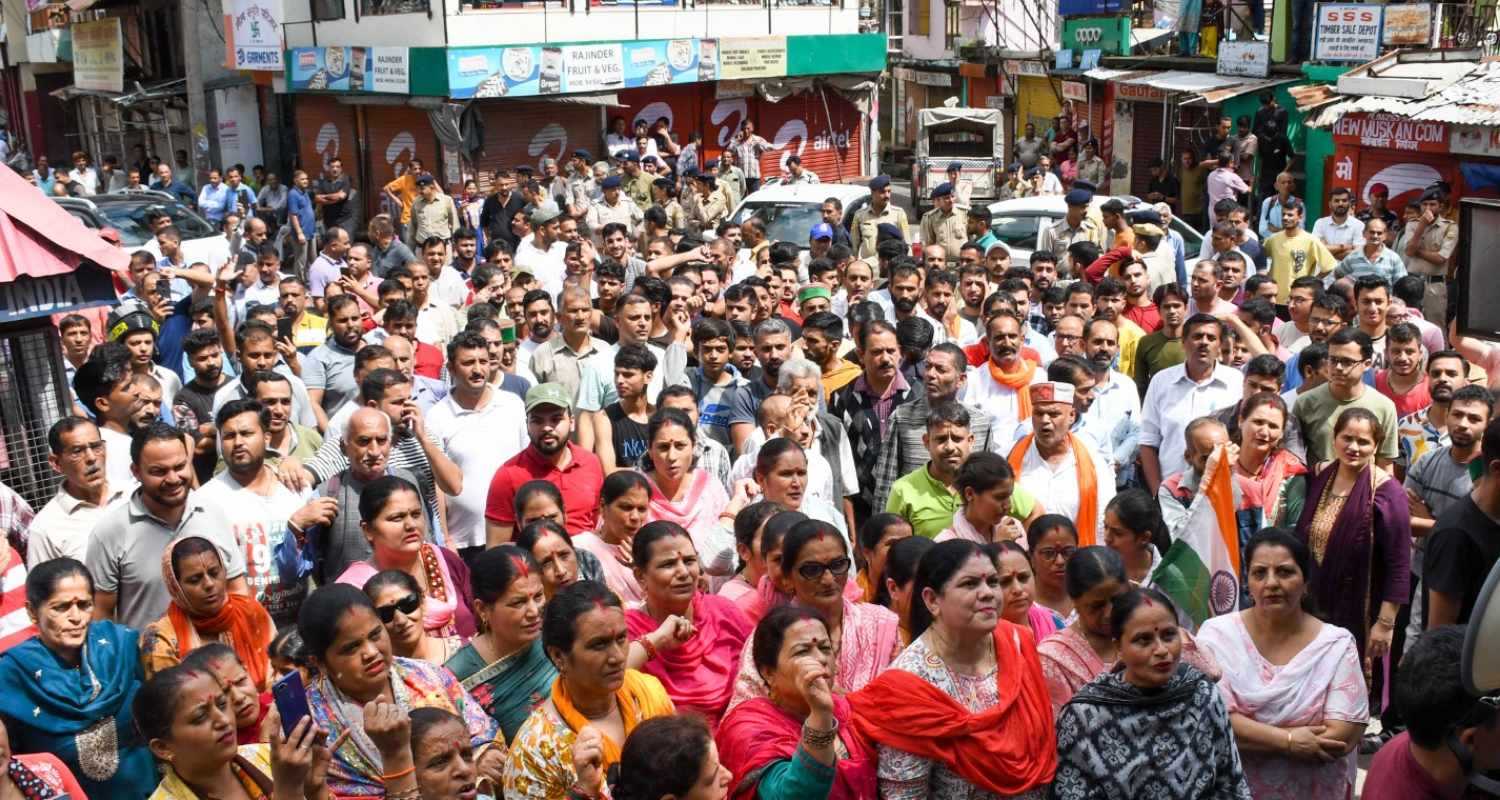 People raise slogans during a protest called by Hindu organisations against the alleged illegal construction at a mosque, in Shimla district, Saturday. 