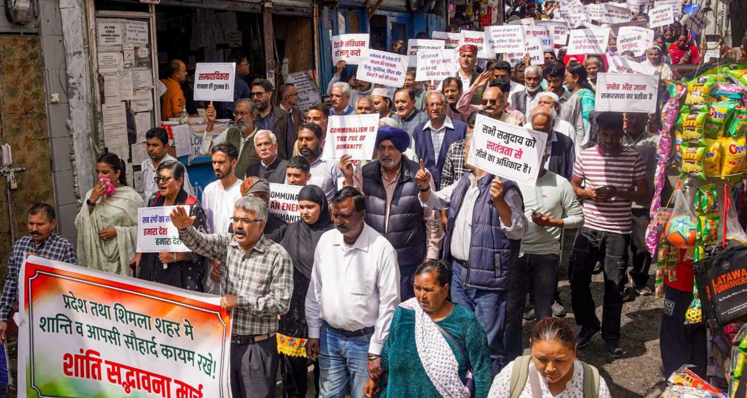 People from Muslim community and various other organisations take part in a peace march after protests erupted over alleged illegal construction at a mosque in Sanjauli, in Shimla, Friday. 