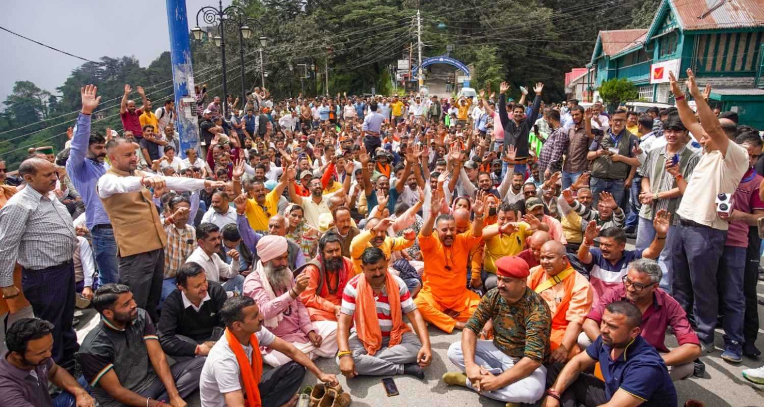 People raise slogans during a protest. 