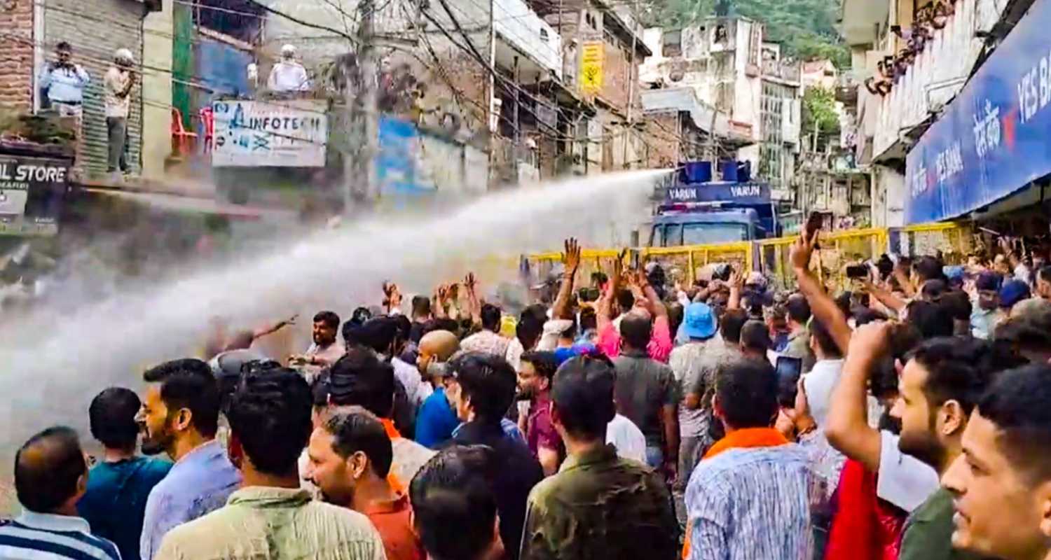 Water cannons being used on agitators during a protest over alleged illegal construction at a mosque in Shimla, in Mandi, Friday. 