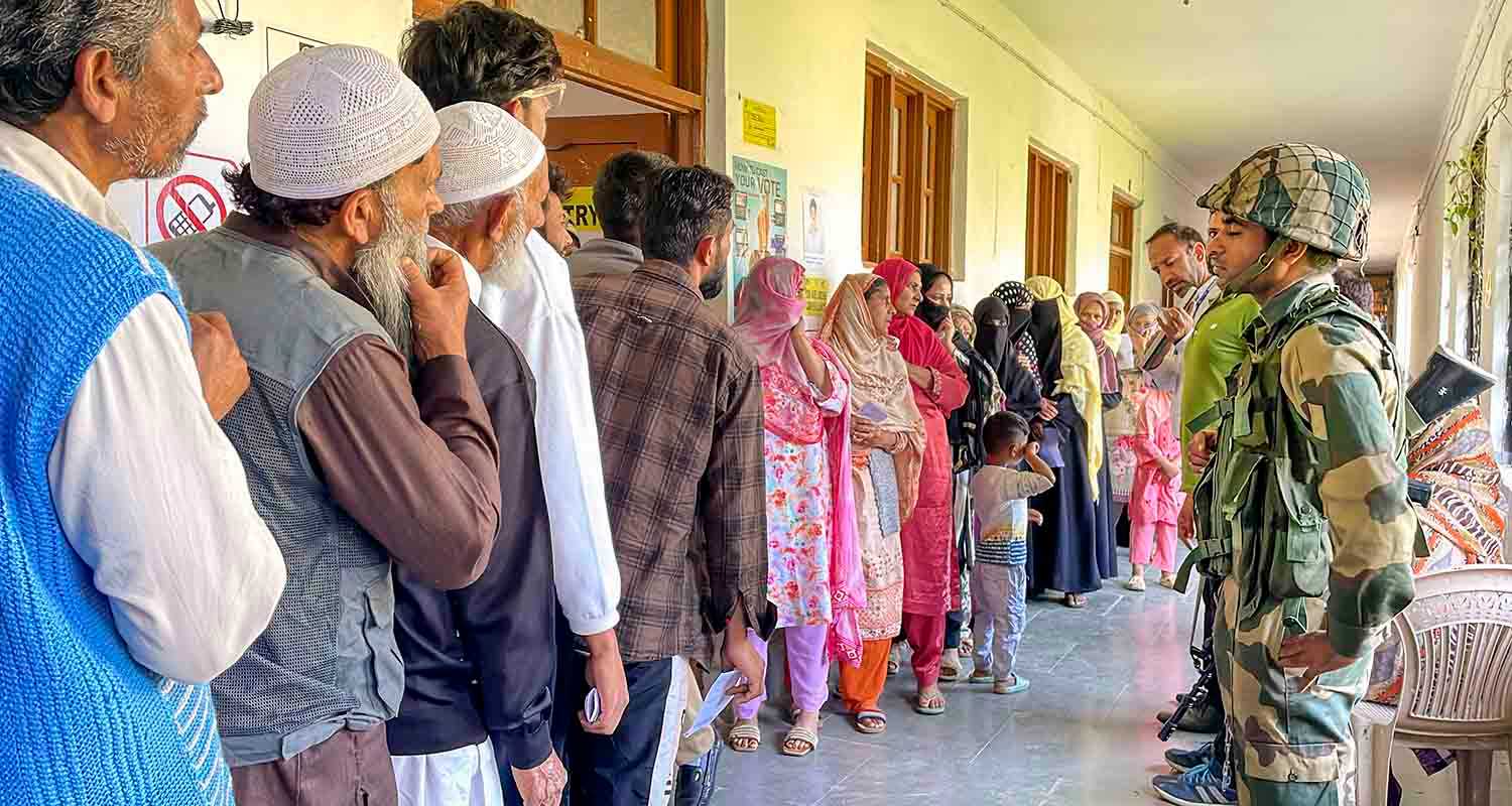 Voters line up outside a polling station in Baramulla, Jammu and Kashmir.