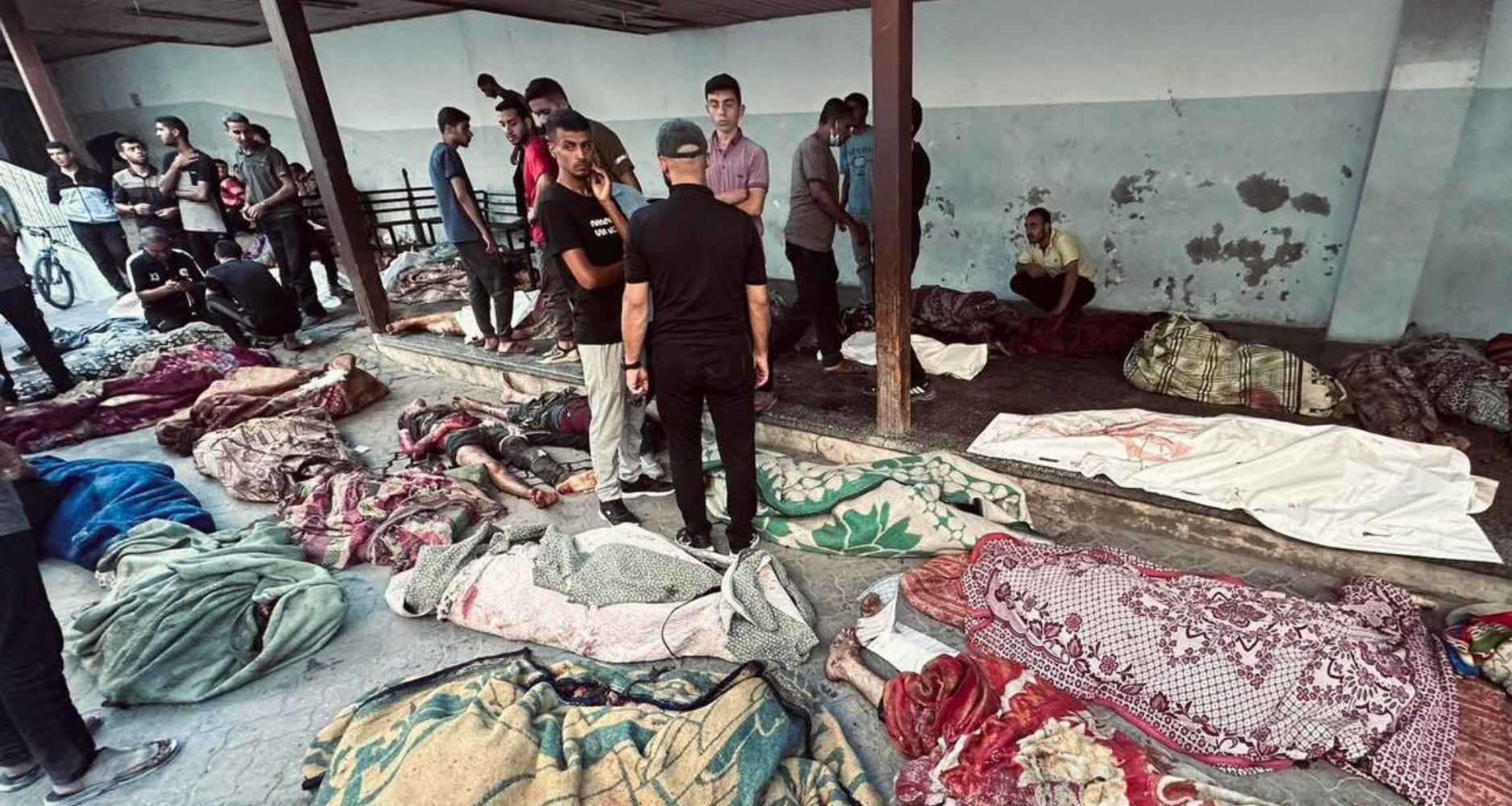 Corpses of victims outside the Tabeen shelter in Gaza. Viewer discretion advised.